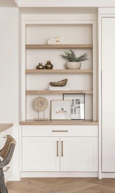 the shelves in this room are white and wood