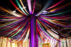 colorful streamers are hanging from the ceiling