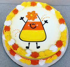 a cake decorated with an orange and yellow design