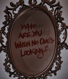 a mirror with writing on it that says, who are you when no one's looking?