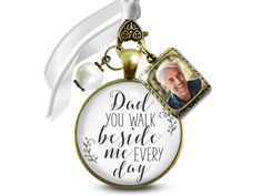 an ornament with the words dad you walk beside me every day