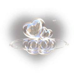 three clear hearts floating in water on a white background