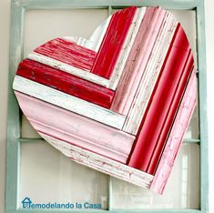 an old window frame is painted red and white