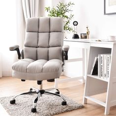 an office chair sitting on top of a rug