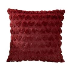 a red pillow that is made from faux fur and has an animal print pattern on it