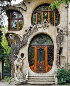 an elaborately designed house with orange doors