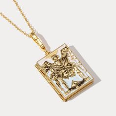 Here is a beautiful Tarot Locket Charm. It is perfect to keep a special picture within it and close to your heart. The Lovers represent relationships and choices. Its appearance in a spread indicates some decision about an existing relationship, a temptation of the heart, or a choice of potential partners. DETAILS Plating: 18K Gold Materials: 18K Gold on Brass, Enamel Necklace Length: Adjustable, 29.52"(75cm) Weight: 32.82g Hypoallergenic design Gold Enamel Amulet Jewelry, Gold Enamel Medallion Necklace, Spiritual Gold Enamel Necklace, Gold Enamel Locket Jewelry, Antique Gold Necklaces With Black Enamel, Gold Enamel Jewelry With Locket, Vintage Gold Jewelry Souvenir, Ceremonial Gold Jewelry With Black Enamel, Gold Medallion Necklace As Souvenir