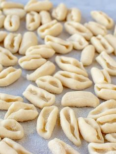 some kind of food that is laying out on a sheet of wax paper and ready to be cooked