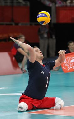 a man is playing volleyball on the court