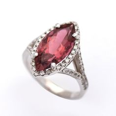 Center stone: marquise cut pink tourmaline 3.83 Cts (16 x 7.5 mm) SI clarityMetal: 14K white goldDiamond: VS1-SI clarity Formal Pink Marquise Diamond Ring, Formal Marquise Ruby Ring With Accent Stones, Formal Pink Marquise Ruby Ring, Pink Marquise Ruby Ring For Formal Occasions, Formal Marquise Pink Ruby Ring, Formal Pink Marquise Cut Diamond Ring, Elegant Pink Marquise Cut Ruby Ring, Elegant Pink Ruby Ring With Marquise Cut, Marquise White Gold Ruby Ring