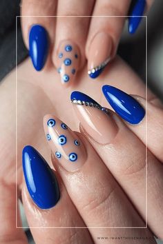 Infinite Elegance: Unlocking the Secrets of Gorgeous Nail Designs - Elevate Your Style to New Heights Protection Eye Nails, Nail Art Evil Eye Design, Evil Eye Inspired Nails, Evil Nail Designs, Blue Eye Nail Art, Azul Nails Ideas, Blue Nails With Evil Eye, Evil Eye Nail Art Design, Royal Blue Nail Art Design