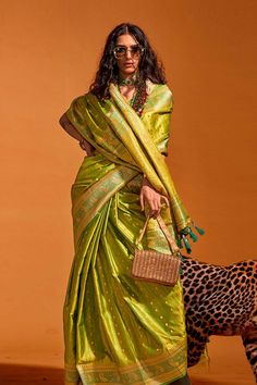 About this Product Saree: Saree Type: Ready to wear saree, Pre-stitched Saree Color: Green Saree Fabric: Pure Satin Type of Work: Foil Print, Lace Trim: Tassels Drape Style: Choose the drape style while order: Standard Open, Pleated or Gujarati Saree length: 5.5 meters Petticoat: Saree comes with an in-built butter crepe petticoat, no additional petticoat is required to wear with the saree. Sizing: Waist is adjustable +/- 1 size with a partial elastic waist band that falls under the drape for ad Affordable Green Saree With Traditional Drape, Luxury Pista Green Pre-draped Saree In Tissue Silk, Cheap Green Saree, Luxury Pista Green Pre-draped Saree For Puja, Petticoat Saree, Gujarati Saree, One Minute Saree, Stitched Saree, Ready To Wear Saree