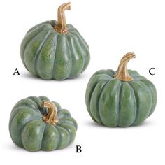 three green ceramic pumpkins sitting next to each other