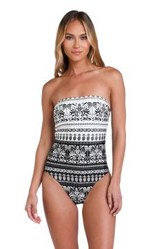 This black and white monochromatic print features an allover tropical motif perfect for any vacation destination. This one piece features a bandeau-inspired top with slender, adjustable spaghetti straps and tie-back detail that adds a contemporary twist to the classic one-piece silhouette. [split] Details Bandeau one piece swimsuit Molded cups Adjustable/removable straps Shaping fit (shirred body and tummy control) High, tie-back Moderate rear coverage Fabric 83% Nylon, 17% Lycra Elastane Vacation Bandeau Tube Top With Adjustable Straps, Bandeau Tube Top With Adjustable Straps For Vacation, Adjustable Bandeau Tube Top For Vacation, White Beachwear Tube Top For Vacation, Strapless Printed Swimwear For Beach, Strapless Printed Beachwear Swimwear, White Strapless Tube Top Beachwear, Strapless Printed Beachwear, Chic Strapless Swimwear For Vacation