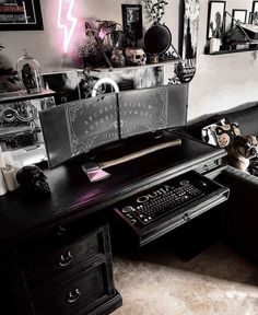 a desk with a keyboard, mouse and pictures on the wall