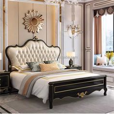 a bedroom with an ornate bed and chandelier