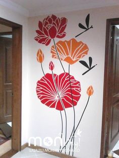 a bathroom wall with flowers painted on it