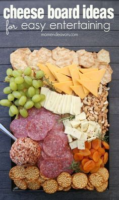 an image of a cheese board with grapes and crackers