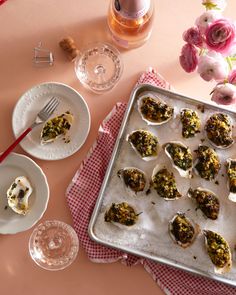 there are many appetizers on the table ready to be eaten and put in the oven