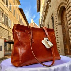 This bag has been made of the best genuine leather by local master crafters of Florence in Italy, designed for women who only accept premium Italian quality and luxury leather bags and modern Italian fashion. . Sizes: Width: 30 cm / 11.8 inches Height: 23 cm / 9.1 inches Depth: 11 cm / 4.4 inches The story of this bag: Once upon a time, in the picturesque city of Florence, Italy, a group of skilled artisans embarked on a journey to create a remarkable handmade leather bag that would epitomize the essence of Italian craftsmanship. Their dedication and expertise gave birth to a brown bag that exuded timeless elegance and unmatched quality. Handcrafted with meticulous attention to detail, this Italian leather bag was a testament to the artisans' unwavering commitment to their craft. The soft, Elegant Vegetable Tanned Leather Travel Bag, Elegant Vegetable Tanned Leather Shoulder Bag For Everyday Use, Classic Vegetable Tanned Leather Shoulder Bag For Shopping, Elegant Everyday Shoulder Bag In Vegetable Tanned Leather, Elegant Vegetable Tanned Leather Tote Bag, Elegant Brown Shoulder Bag In Vegetable Tanned Leather, Elegant Vegetable Tanned Leather Shoulder Bag With Double Handle, Elegant Satchel In Soft Vegetable Tanned Leather, Elegant Vegetable Tanned Leather Satchel