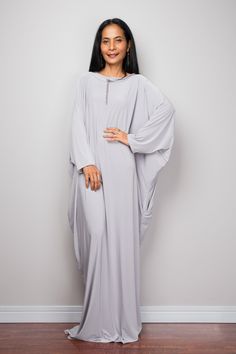 "Kaftan Dress, Maxi Dress, Long gray dress, Loose fit dress, light grey dress, modest dress PRODUCT SIZE : One Size Fits Most * Chest : free up to 58\" * Waist : free up to 58\" * Hips : free up to 58\" * Circumference bottom hem : 45\" * Length : 56\" * Sleeve length : 23\" MATERIAL * Spandex Venetia * Zipper on the back MODEL : * Model chest : 32\", Height 160 cm (5.2) without high heel * Accessories excluded Produced by NUICHAN IMPORTANT NOTE *Please note that colours shown on your monitor ma Formal Fitted Floor-length Kaftan, White Fitted Long Dress Kaftan, Gray Flowy Maxi Dress, Fitted Long Dress-style Kaftan, Gray Floor-length Maxi Dress, Elegant Beige Maxi-length Kaftan, White Oversized Maxi-length Kaftan, Grey Long Dress, Light Grey Dress