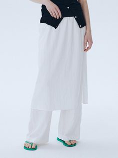 This is a modern and unique pants with skirt by ahwe that is made out of high quality and sturdy fabric. With minimal design detail and trendy mood, you can style it for your casual and refined daily outfit.- Elastic waistband- Skirt layered on top of the pants- Relaxed wide silhouette Flowy White Skirt For Daywear, High Waist White Flowy Skirt, White Relaxed Cotton Skirt, White Relaxed Fit Cotton Skirt, Versatile White Bottoms With Elastic Waistband, Versatile White Bottoms For Spring, Modern White Ankle-length Wide Leg Pants, Chic White Flowy Skirt, Modern Bottoms With Elastic Waistband For Summer