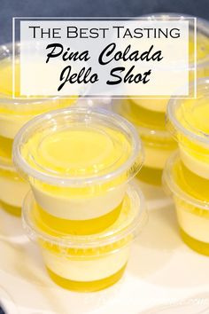 the best tasting pina colada jello shot in plastic cups with text overlay