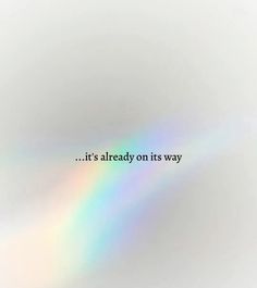 the words it's already on its way are shown in rainbow - hues