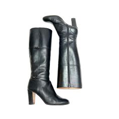 Vintage 1970s black Italian leather knee high zip up fashion boots by Julianelli. Features black leather uppers, rounded toe, knee high rise, small strap and buckle detail at shaft, full length zip at inner side, flat tops, and column heel. Excellent vintage condition. Made in Italy.   Heel to toe (inside shoe): 10 inches  Ball of foot (bottom of sole): 3.125 inches  Heel height: 3 inches  Shaft height: 16.25 inches  Circumference: 13.5 inches  Size 8.5 Vintage Formal Boots With Buckle Closure, Vintage Almond Toe Boots For Workwear, Vintage Almond Toe Boots For Work, Vintage Fitted Boots For Work, Fitted Vintage Boots For Workwear, Vintage Fitted Knee-high Boots For Formal Occasions, Fitted Vintage Knee-high Boots For Formal Occasions, Vintage Leather Knee-high Boots For Formal Occasions, Vintage Knee-high Boots For Formal Occasions