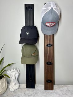 a pair of skis and hats are hanging on the wall