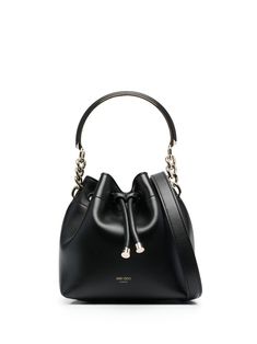 Bon Bon bucket bag from JIMMY CHOO featuring black, calf leather, embossed logo to the front, drawstring fastening, main compartment, internal slip pocket, single metallic top handle and adjustable detachable shoulder strap. Jimmy Choo Bags, Jimmy Choo Bag, Bon Bon, Embossed Logo, Curator Style, Jimmy Choo, Top Handle, Calf Leather, Bucket Bag