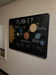 a sign on the wall that says plan - t ahead of time