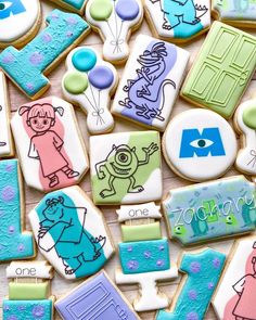 decorated cookies are displayed on a table