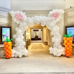 an entrance decorated with balloons and carrots