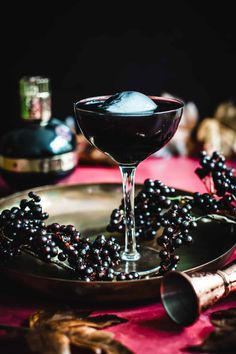 Unleash your inner night owl with our captivating Full Moon Cocktail - a velvety black elixir that's as mysterious as it is alluring. Full Moon Martini, Full Moon Drink, Eclipse Themed Cocktail, Moon Themed Cocktails, Werewolf Cocktail, Eclipse Cocktail Ideas, Full Moon Cocktail, Solar Eclipse Cocktails, Quirky Cocktails