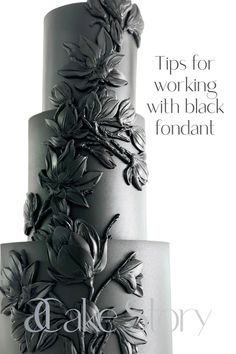 a three tiered cake with flowers on it and the words, tips for working with black fondant