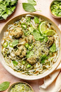 a bowl filled with meatballs and noodles