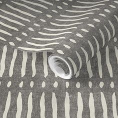 a grey and white patterned fabric with small dots