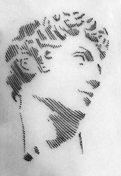 a black and white drawing of a woman's face with lines coming out of it