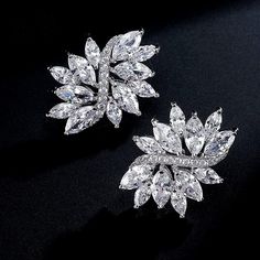 "These delicate Cubic Zirconia Wedding Earrings are 1\" h x 3/4\" w and feature clusters of dainty marquise. Using top grade CZ's plated in Genuine Platinum based rhodium, these pierced earrings have the rich look of fine diamond bridal jewelry. Size: 2.7cm x 2cm Matching bracelet available and sold separately: https://www.etsy.com/listing/167834165/bridal-bracelet-bridal-jewelry-wedding?ref=shop_home_active_14&ga_search_query=bracelet I offer discounts on bulk qty. Also available in gold fi Christmas Pageant, Bridal Diamond Jewellery, Jewelry Bridesmaid, Wedding Bridal Jewellery, Cubic Zirconia Earrings, Matching Bracelet, Bridal Bracelet, Wedding Jewelry Earrings, Zirconia Earrings