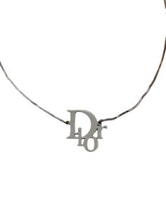 Christian Dior Necklace Silver Logo Monogram Vintage Authentic Y2K Total length 41cm Adjustable from 36cm Vintage - Good condition with signs of tarnish. Hallmarked Dior ⭐ 100% Authentic ⭐ FREE WORLDWIDE SHIPPING 🌎 Luxury Silver Jewelry With Logo, Designer Silver Jewelry With Logo, Luxury Sterling Silver Jewelry With Logo, Elegant Metal Necklace With Silver-tone Logo, Formal Silver Necklace With Logo Charm, Luxury Silver Monogram Necklace, Luxury Monogram Silver Necklace, Formal White Gold Necklace With Logo Charm, Luxury Monogram White Gold Necklace