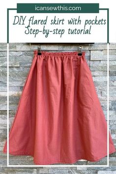 a red skirt hanging on a brick wall with text overlay that reads diy flared skirt with pockets step - by - step