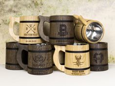 several wooden beer mugs stacked on top of each other with the same logo and emblem