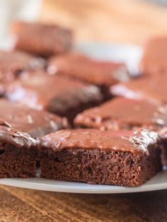 chocolate cake with frosting on a white plate