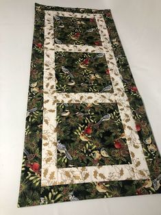 the table runner has birds on it