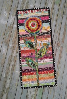 a patchwork quilt with a flower on it