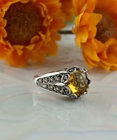 Citrine Oxidized Silver Victorian Cocktail Ring, 925 Sterling Silver Artisan Handmade Vintage Boho Filigree Statement Ring Yellow stone ring, gift ring for women her, vintage jewelry Material: 925 Sterling Silver ( NICKEL FREE ) Gemstone: Citrine 10 mm. FREE, FAST AND TRACKABLE SHIPPING FOR ALL EU COUNTRIES AND USA. COMES WİTH VELVET POUCH AND LUXURY GİFT BOX. Show off this gorgeous yellow stone ring at any occasion. This eye catching ring is perfect to add glam to any outfit with citrine quartz Gemstone. This vintage, original, and stylish luxury jewelry is perfect for wearing at parties, festivals and everyday life.  Our handmade pieces are the perfect gift ring for her, mom, wife, daughter, friend, lover, relative, etc. ideal gift for birthday, anniversary, christmas, graduation, and mo Ring Yellow Stone, Yellow Stone Ring, Yellow Stone Rings, Eu Countries, Sterling Silver Filigree, Yellow Stone, Citrine Gemstone, Luxury Gift Box, Velvet Pouch