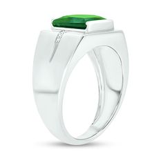 He'll love the eye-catching color of this modern ring. Crafted in cool 10K white gold, this design features a 9.0mm channel-set square-cut verdant-green lab-created emerald. Inlaid rows of diamond accents flank the center and continue along the grooved shank. Buffed to a brilliant luster, this ring makes a bold statement of style. Modern Platinum Gemstone Rings, Modern White Gold Emerald Ring For Formal Occasions, Modern Green Rings With Prong Setting, Modern Emerald Rings With Center Stone, Modern Round Emerald Ring With Center Stone, White Gold Emerald Ring With Polished Platinum Finish, Modern White Gold Emerald Ring With Vvs Clarity, White Gold Emerald Ring With Platinum, Modern Emerald Ring With Diamonds