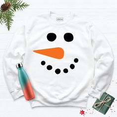 Snowman Face Christmas Couples Sweatshirt, Family Christmas Hoodie, Christmas Party Snowman Face Sweatshirt, Winter Christmas Hoodie. Hi! Welcome to our store. It's good to see you here. IMPORTANT MATTERS FOR ORDERING: 1-) Please check and review all photos. 2-) Our sizes are true to size, but can you take a look at my measurements in the product details section to make sure you get the best fit? The measurement is from armpit to armpit. Please let me know if you have any questions. BUSINESS DAY Snowman Shirts, Christmas Couples, Funny Snowman, Snowman Shirt, Snowman Faces, Couples Sweatshirts, Christmas Hoodie, Winter Shirts, Good To See You