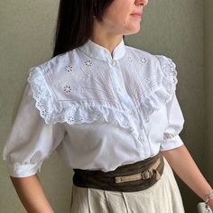 Cute vintage white cotton  blouse  with balloon sleeves and embroidery .  It is amazing!! **Material: 50%cotton,50%polyester.  **Great vintage condition, it's perfect white.  No holes or spots! ** Size40(M).  Model is size M and 170 cm height, bust 95 cm. Wear this adorable blouse under pinafore dresses or skirts for a cute daytime look. This item will come to you freshly laundered and ready to wear. White Blouse With Floral Embroidery And Peter Pan Collar, Bohemian Broderie Anglaise Short Sleeve Blouse, Bohemian Broderie Anglaise Blouse For Daywear, Cottagecore White Blouse With Lace Collar, White Cottagecore Blouse With Lace Collar, Bohemian Blouse With Broderie Anglaise Short Sleeves, White Embroidered Blouse With Peter Pan Collar, Vintage Cotton Blouse With Lace Top, Vintage Broderie Anglaise Blouse